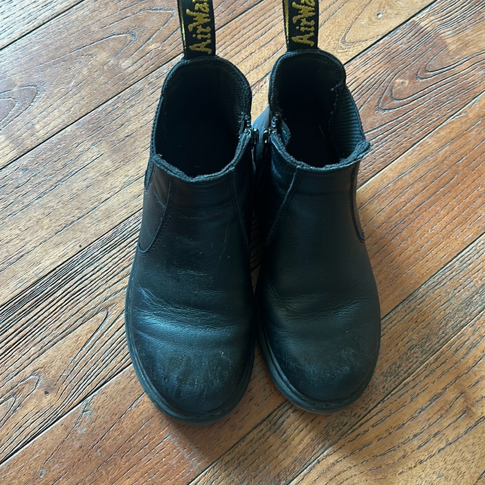 Boys black Doc Marten boots.